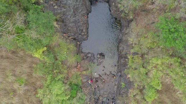Aerial Top Shot Of People Having Fun In River During Vacation, Drone Flying Upward Over Landscape - Zambales, Philippines 