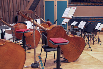 Close-up of contrabasses on a stage