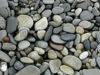 Fototapeta na wymiar gray sea stones, background texture