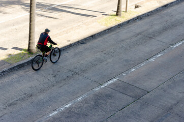 Fototapeta premium a bicyclist riding on an empty street