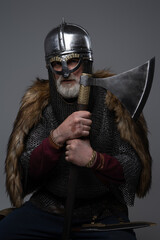 Old age scandinavian warrior with axe and mail