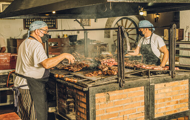 Chefs in Face Mask Using Grill