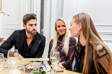 Group of friends conversating during dinner