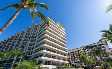 Fototapeta na wymiar Luxury condominiums and apartments on Playa De Los Muertos beach and pier close to the famous Puerto Vallarta Malecon, the city largest public beach.