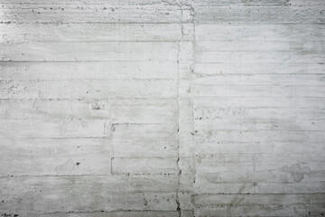 Old concrete wall with visible layers, painted white, fragment