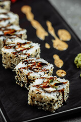 California Roll sushi with smoked eel, cucumber, avocado. Sushi menu. Japanese food