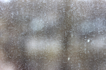 Streaks and traces of raindrops on the dirty window glass. Blurry and unfocused background. - obrazy, fototapety, plakaty