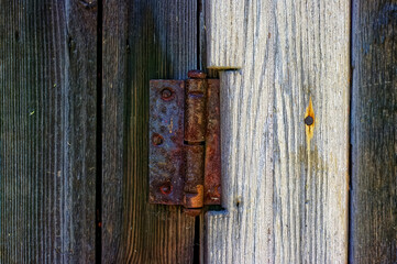 rusty door hinge on the barn