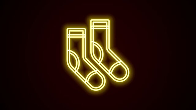 Glowing neon line Socks icon isolated on black background. 4K Video motion graphic animation