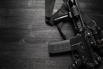 Airsoft rifle on the black flat lay background. - obrazy, fototapety, plakaty
