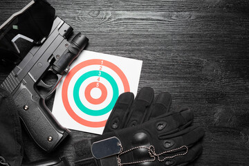 Gun and paper target. Shooting range concept. Shooting practice background.