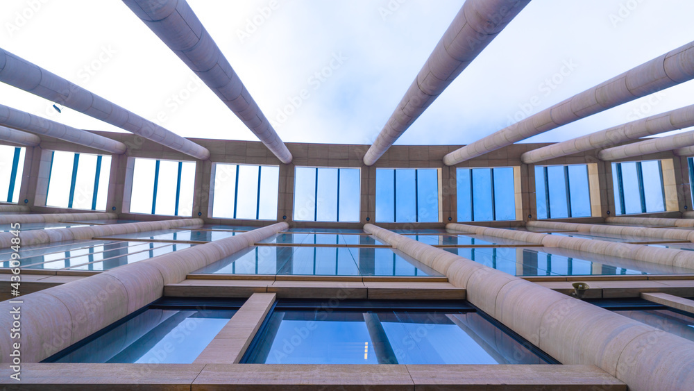 Poster columns building background and sky. abstract bottom view