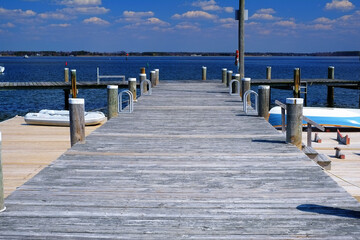 Wooden Boat dock on the wide open Chesapeake bay on a beautiful sunny afternoon