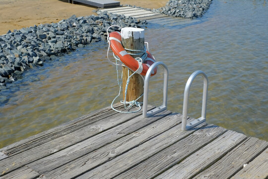 Safety lifesaver on a wooden pier on the Chesapeake Bay in Maryland