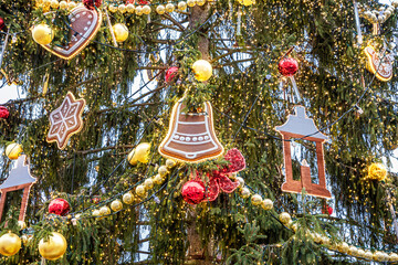 Fototapeta premium Close-up view of a Christmas tree and decorations on the branches outdoors in Prague in winter holiday season