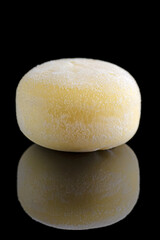 Wagashi mochi with Mango on black background. Copy space