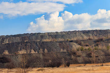 View of slag heaps of iron ore quarry. Mining industry