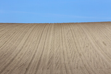 Obraz na płótnie Canvas Landscape agricultural land in slope recently plowed for the crop