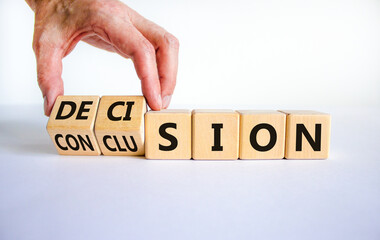 Decision or conclusion symbol. Businessman turns wooden cubes and changes the word 'conclusion' to 'decision'. Beautiful white background. Business, decision or conclusion concept. Copy space.