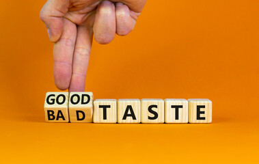 Good or bad taste symbol. Businessman turns wooden cubes and changes words 'bad taste' to 'good...