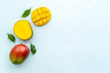 Layout of mango and leaves. Tropical fruits background