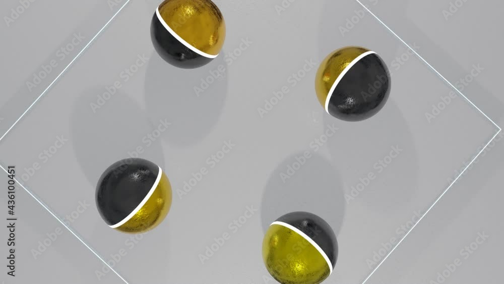Poster two-tone black gold balls roll back and forth on the rough white surface. animated looping screensav