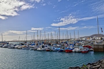 landscape with harbor and yachts on the spanish canary island of fuerteventura on a sunny day
