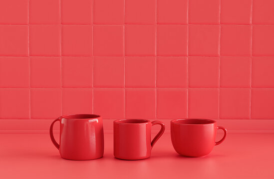 Solid Red Color Three Different Coffee Mugs Side By Side On Monochrome Red Color Kitchen Counter Top With Wall, Close Up Front View, 3d Rendering, No People