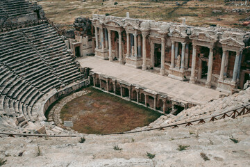 Fototapeta premium Ancient Roman amphitheater made of stone under the open sky in Pamukkale in Turkey
