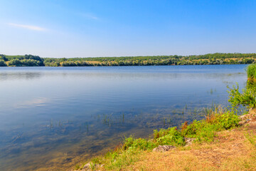 Summer landscape with beautiful river, green trees and blue sky
