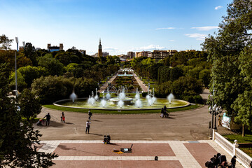 urban landscape of the spanish city of Zaragoza on a warm spring day with fountains in the landmark park