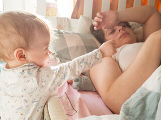 a small child woke his mother up early in the morning.