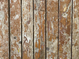 Brown wood texture of natural wood from vertical planks with knots. The background