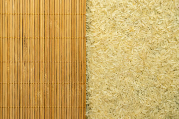 texture of rice grains on a bamboo table close-up