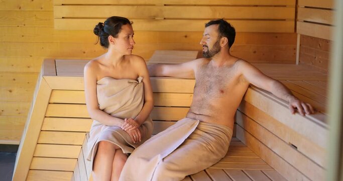 Adult caucasian couple resting in a sauna, having a child-free weekend in Spa