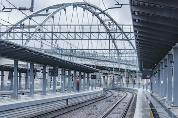 Passenger platforms of station at rainy day.