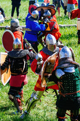Battle of medieval knights on the battlefield, historical reconstruction