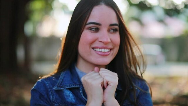 Happy young woman portrait smiling outside, millennial girl