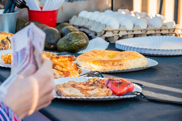 Close-up of a woman's hand with a paper currency