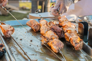 Fried shish kebab on skewers on the counter