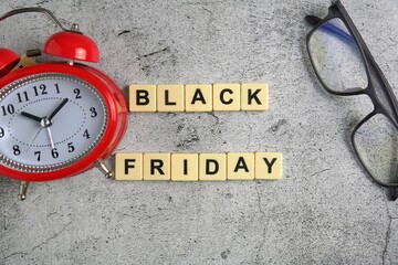 Black Friday is a colloquial term for the Friday following Thanksgiving in the United States, block on ceramic background.