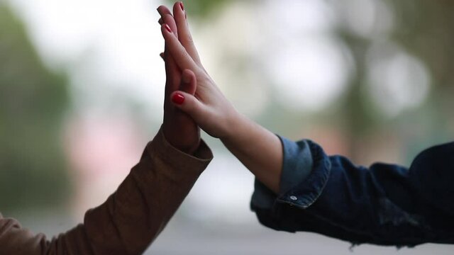 Two Diverse people hands joining hands in union