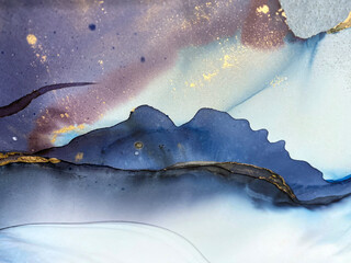 Abstract purple art with gold — violet and blue background with beautiful smudges and stains made with alcohol ink and golden pigment. Lilac fluid art texture resembles watercolor or aquarelle.