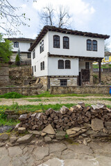 Typical street and old houses at historical village of Bozhentsi, Bulgaria