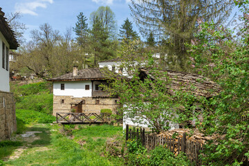 Typical street and old houses at historical village of Bozhentsi, Bulgaria