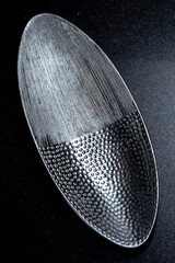 textured silver oval empty plate.
