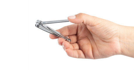 woman's hand holding a tool for nail grooming. White background.