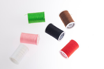 threads of different colors on flank background.