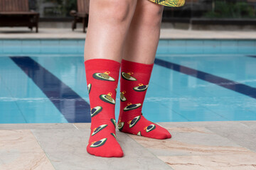 young man wearing sock in a swimming pool