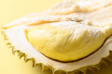 Ripe Thai durian fruit (Monthong) on yellow background, Tropical fruit